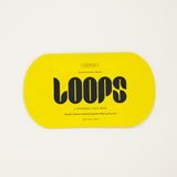 Yellow packaging of LOOPS brightening mask on a white background