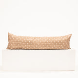 light brown lumbar pillow with diamond block pattern print