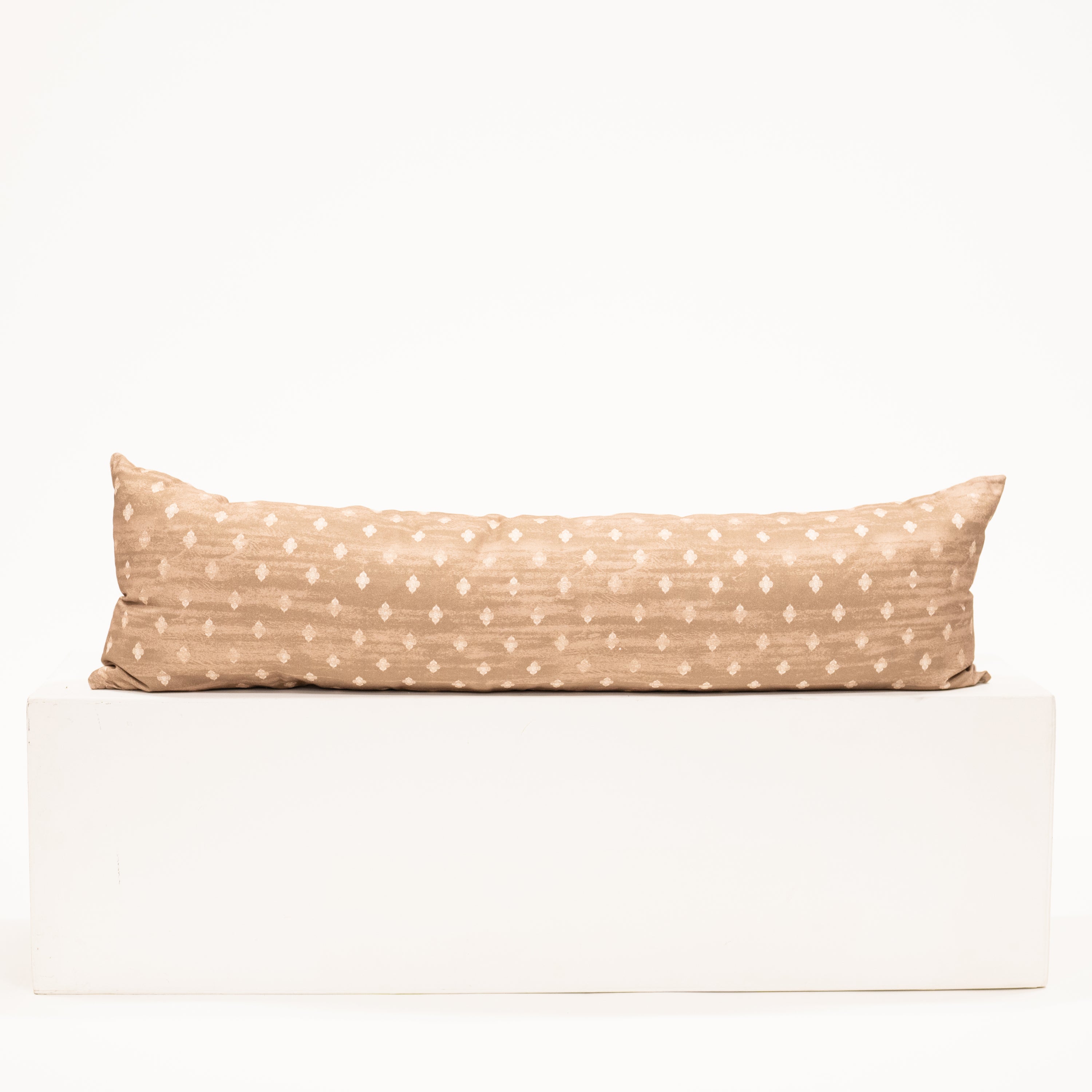 light brown lumbar pillow with diamond block pattern print