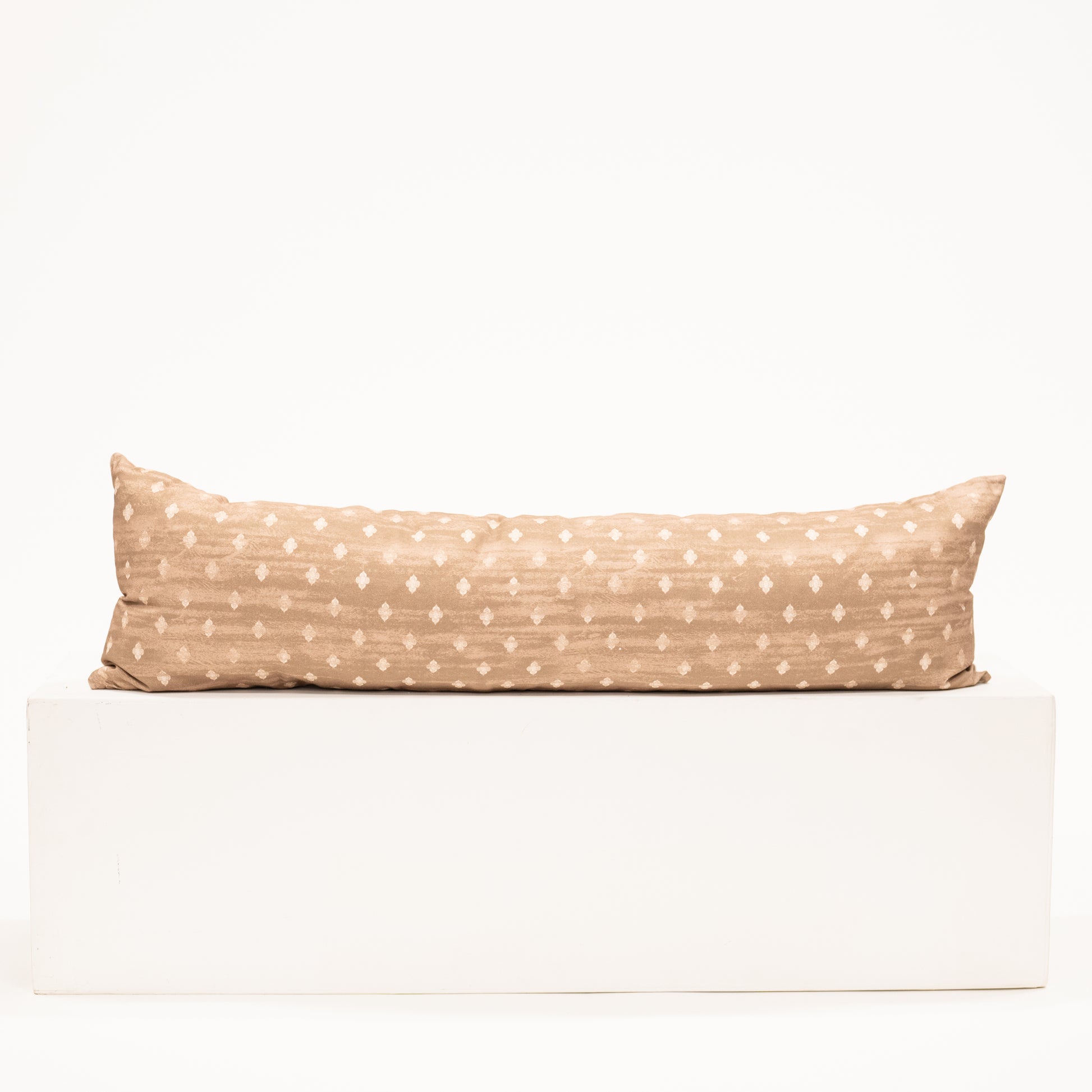 light brown lumbar pillow with diamond block pattern print