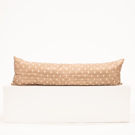 light brown lumbar pillow with diamond block pattern print