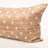 light brown lumbar pillow with diamond block pattern print