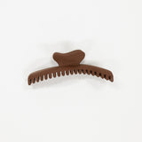 Brown hair clip on a white background