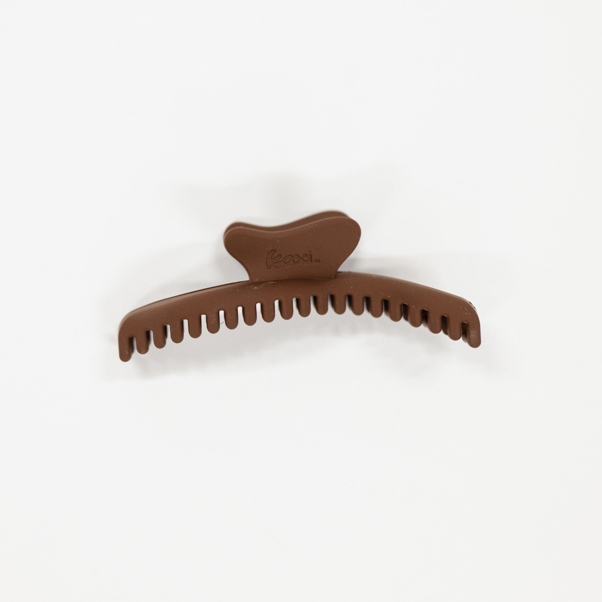 Brown hair clip on a white background