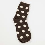 brown colored socks with puff raised white dots
