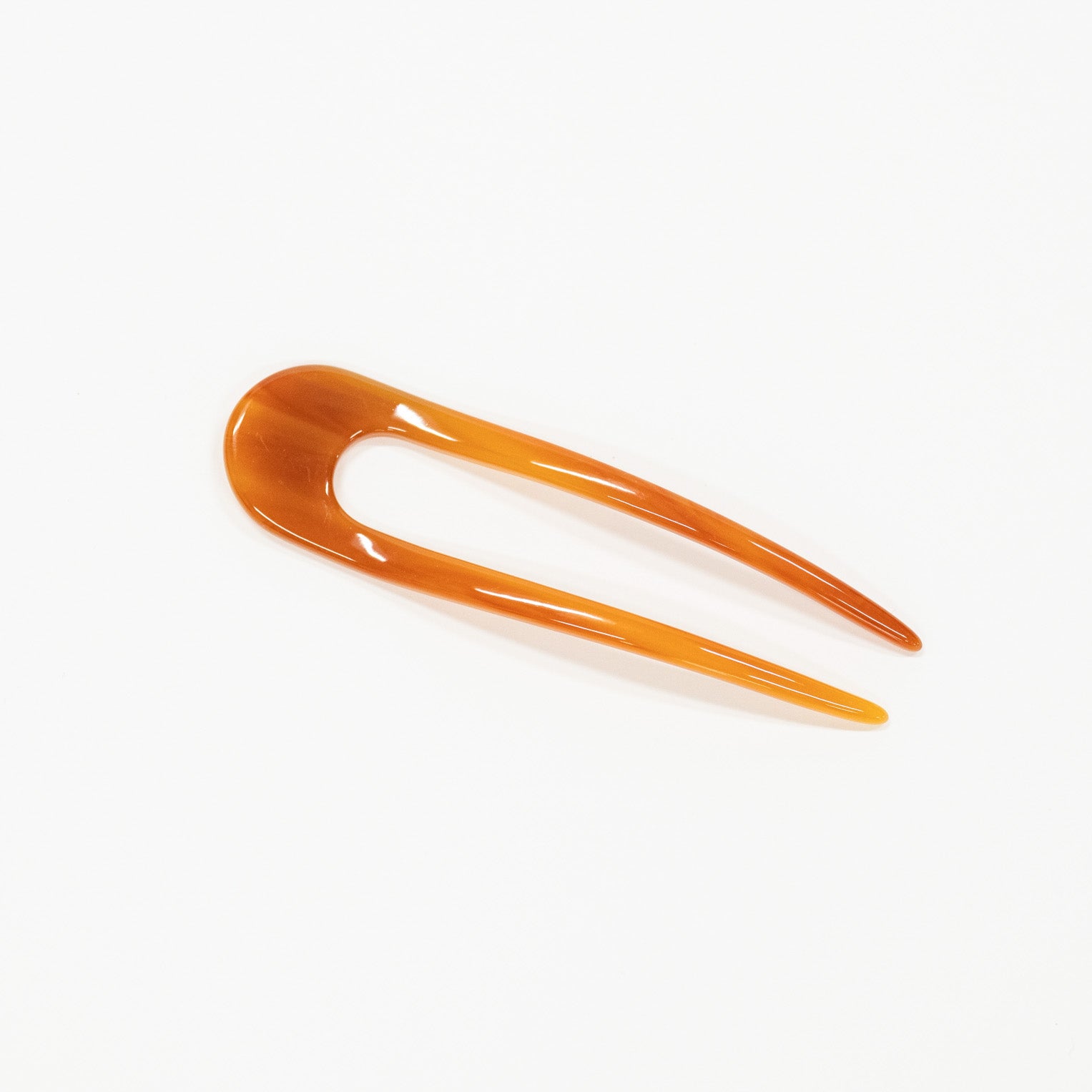 amber hair pick on a white background