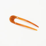 amber hair pick on a white background