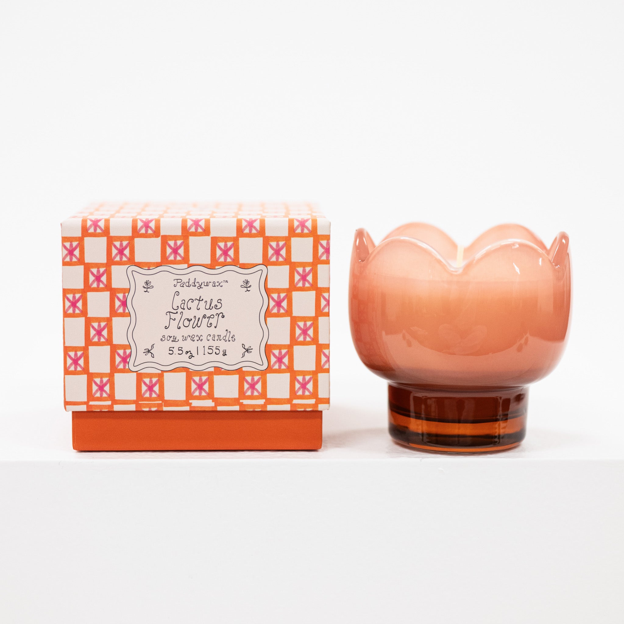 tulip shaped Candle with decorative packaging on a white background