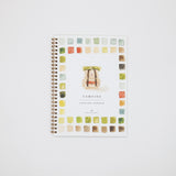 Notebook with colorful watercolor design on a white background