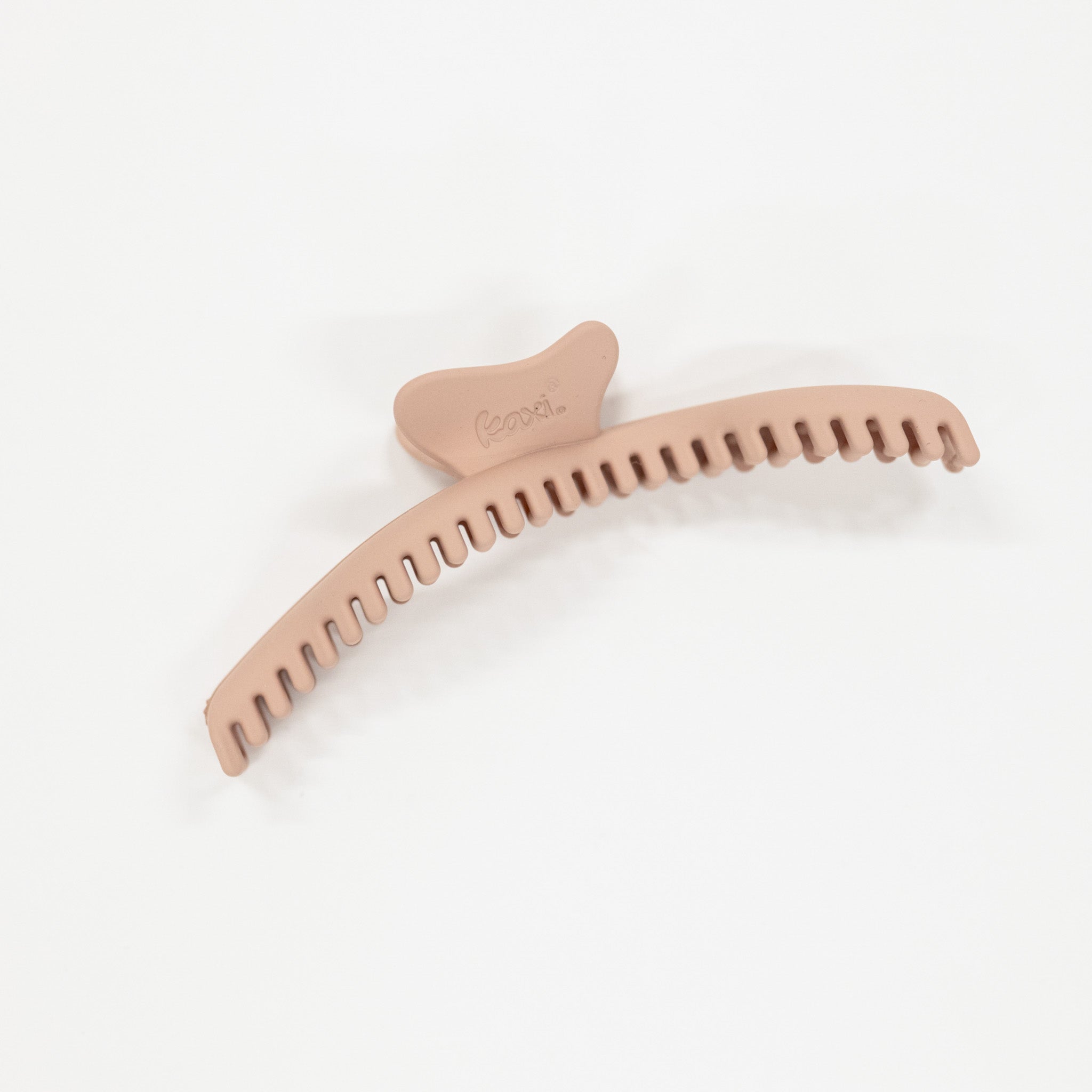 Pink hair comb on a white background