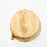 Wooden cutting board with a natural finish on a white background