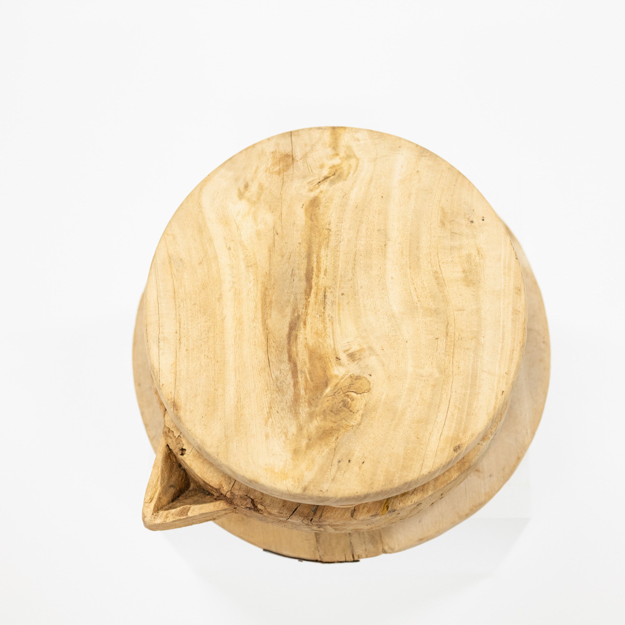 Wooden cutting board with a natural finish on a white background