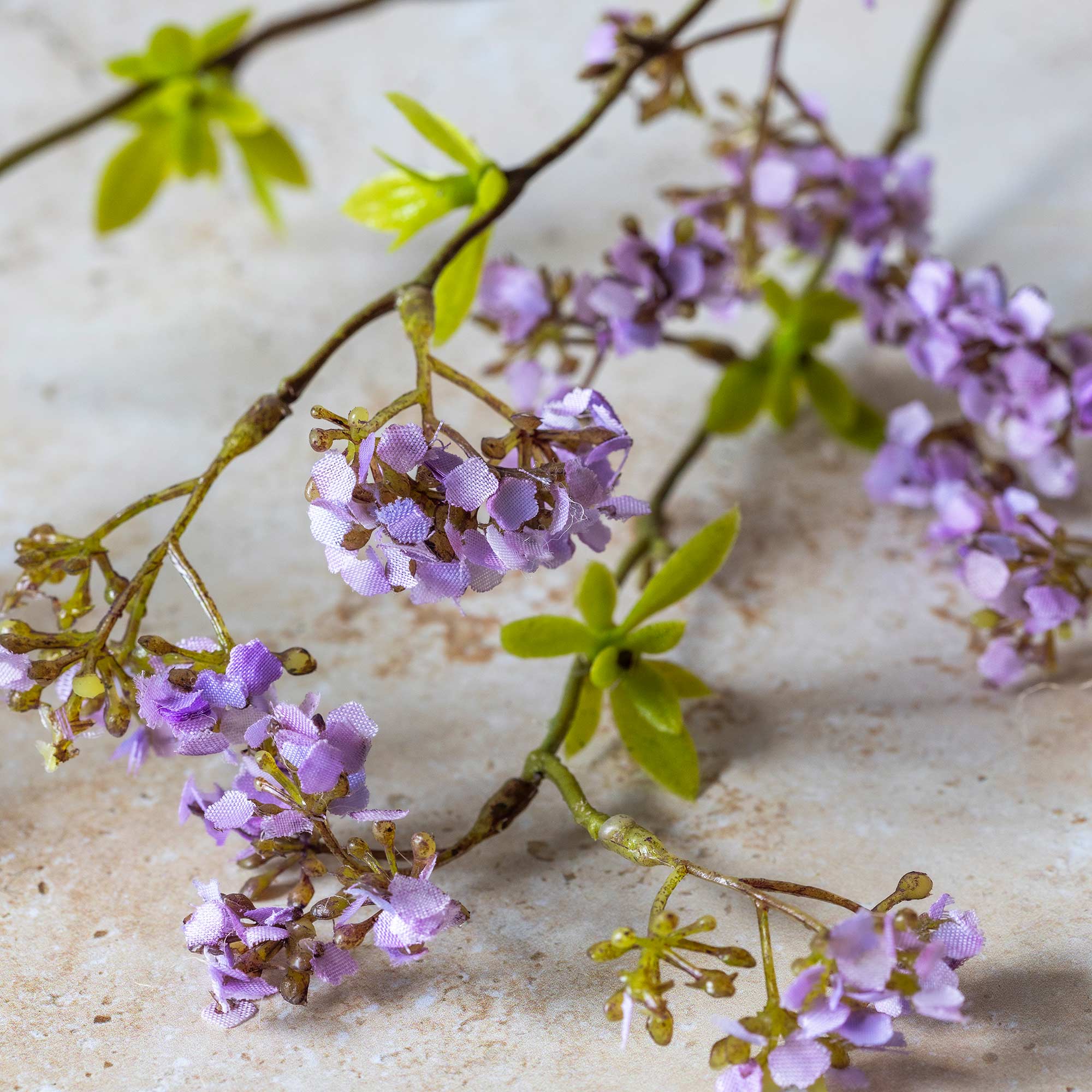 close up of a faux lilac stem