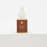 A small square bottle of Cinnamon Cider fragrance oil with a white dropper cap and a brown label, set against a plain white background. Fall scent for Pura.