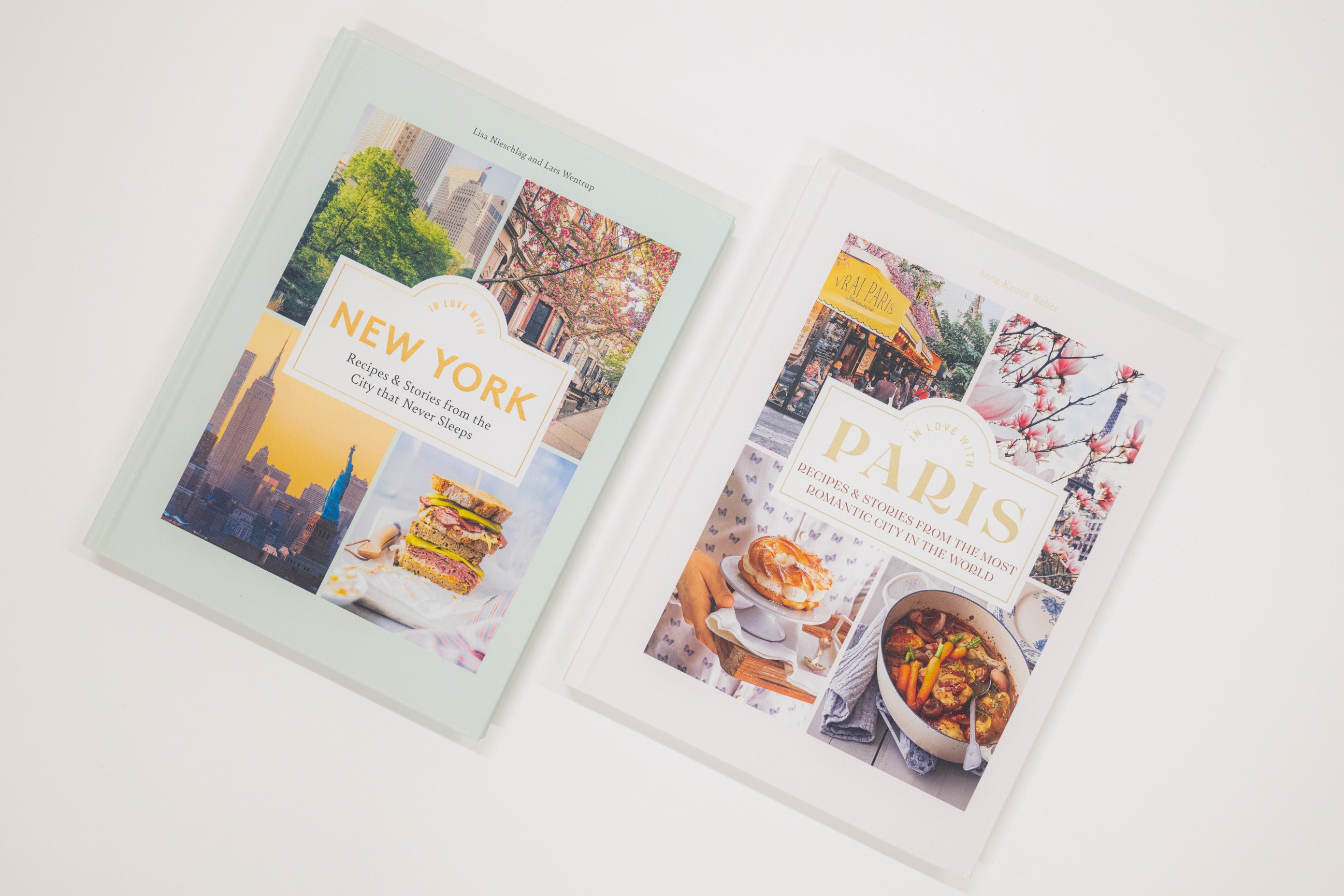 Two travel guidebooks on New York and Paris with images of cityscapes and food.