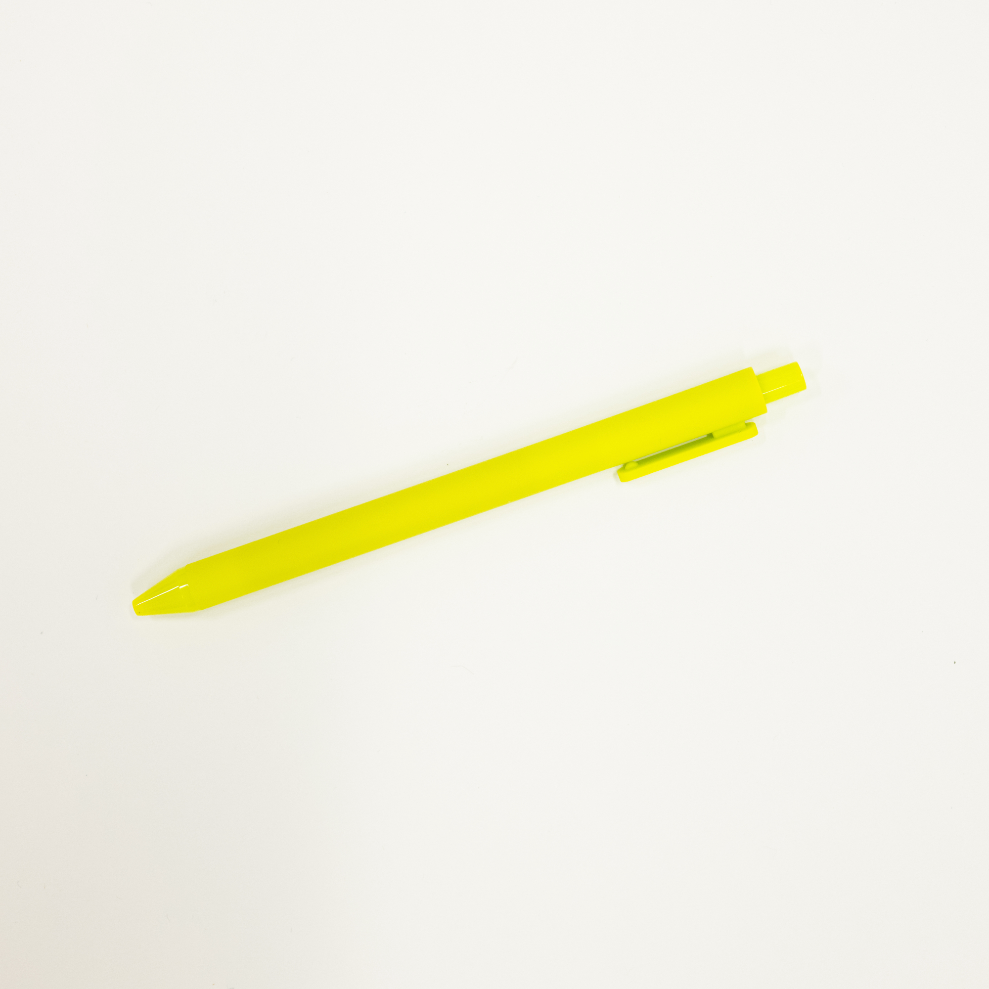 Yellow pen on a white background