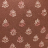 Brown fabric with white and pink floral pattern