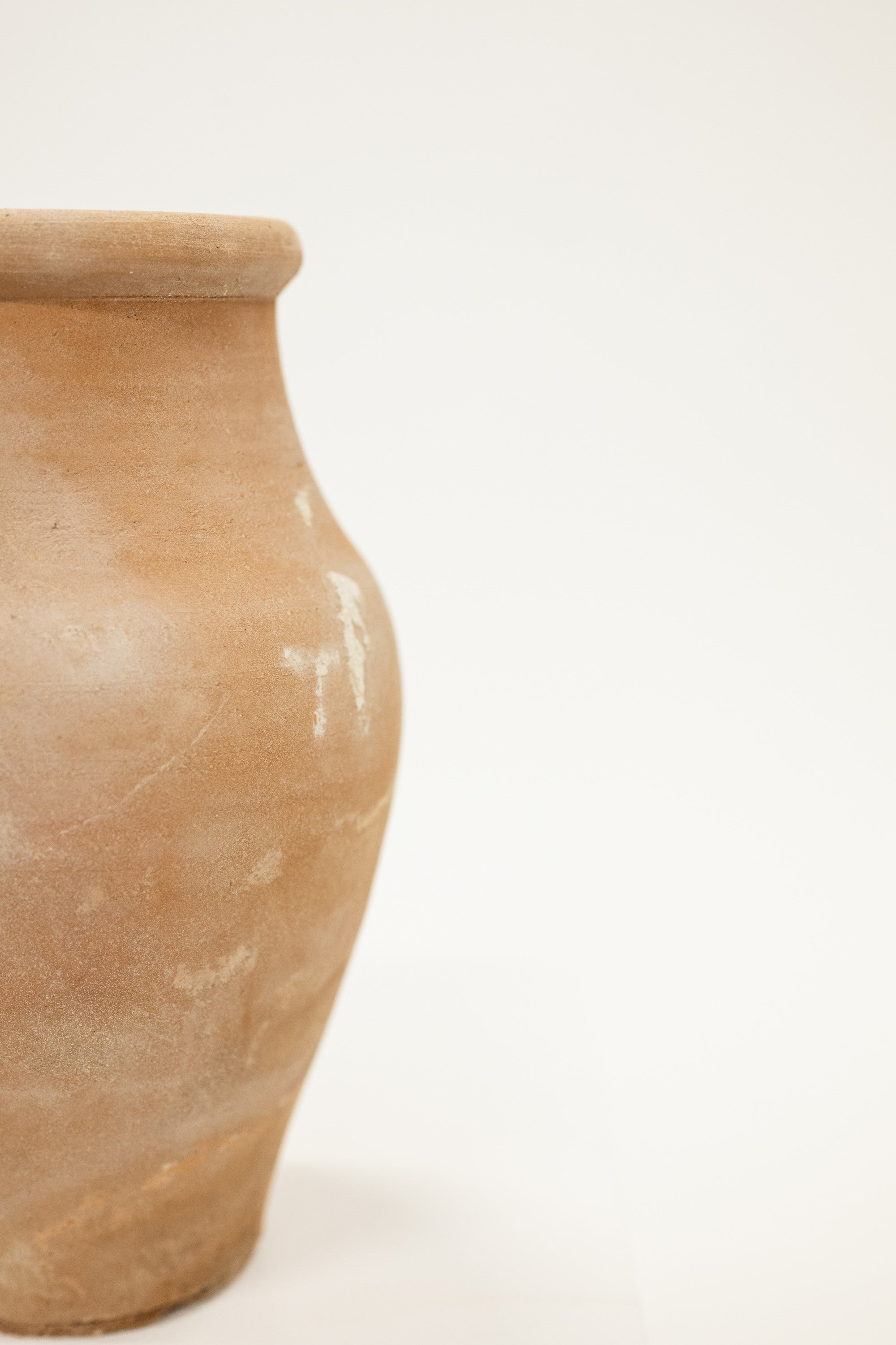 Brown ceramic jar on a white background