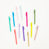 Assorted colorful gel pens on a white background