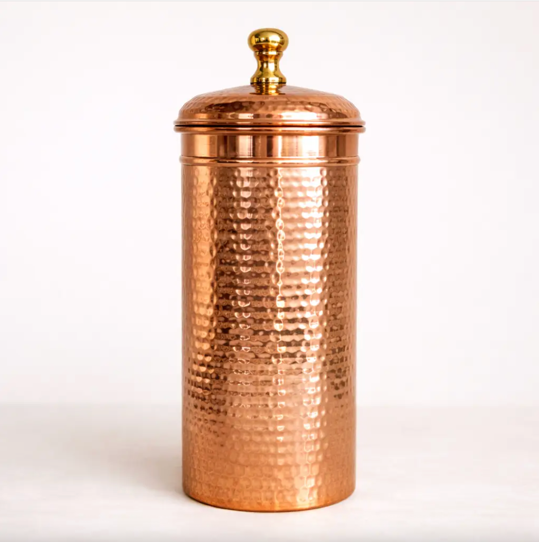 round kitchen canister made with hammered copper