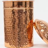 Copper jar with a lid on a white background
