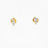 A pair of gold stud earrings with three marquise-cut clear gemstones in a prong setting, displayed on a plain white background.