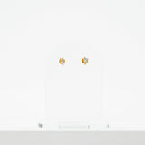 pair of stud earrings, each with a pair of cz stones