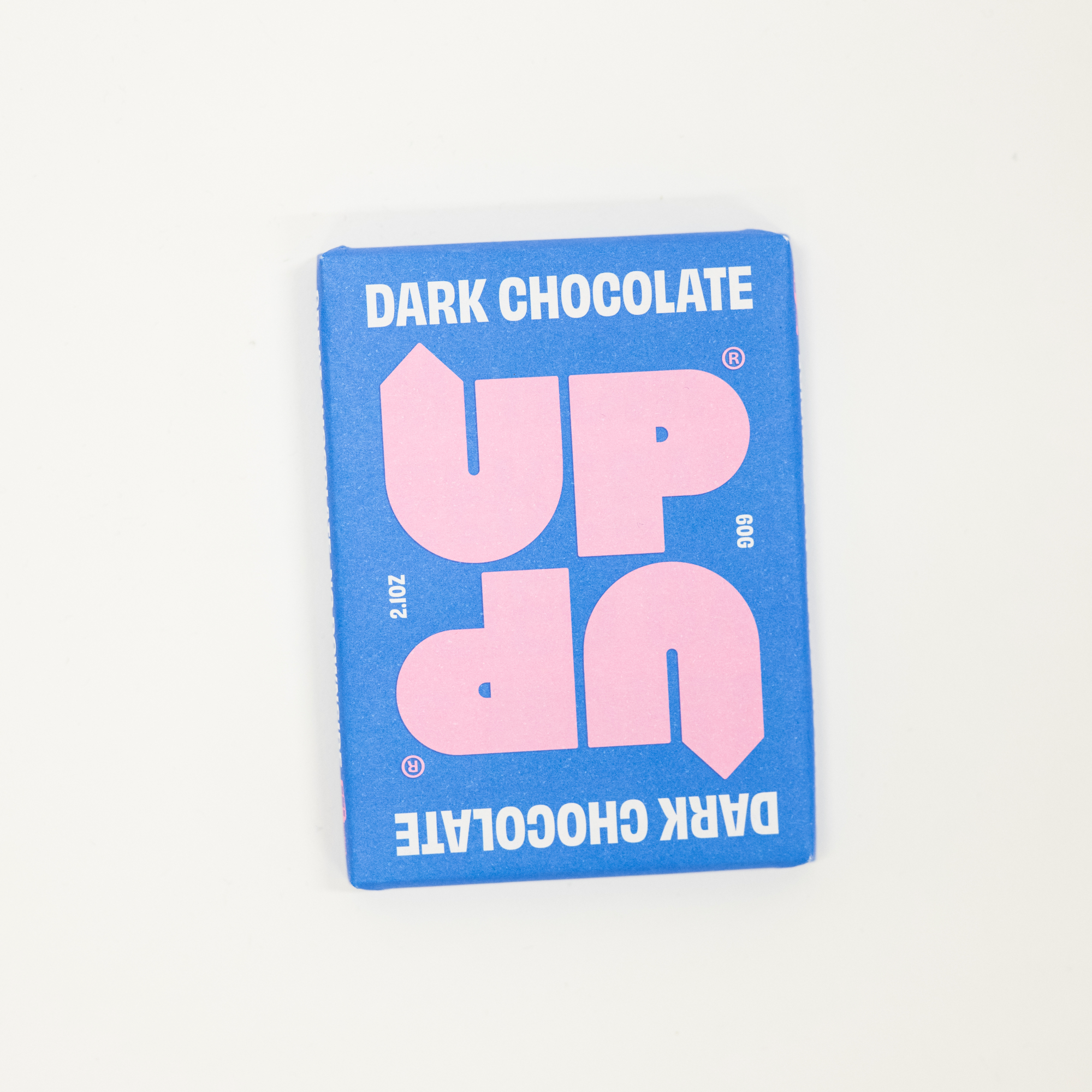 Blue packaging of dark chocolate with pink text on a white background