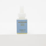 A small bottle of Moodcast Daydreamer pura fragrance oil with a light blue label and white dropper cap, set against a plain white background.