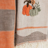 close up look at the embroidered pumpkins on turkish cotton kitchen towels