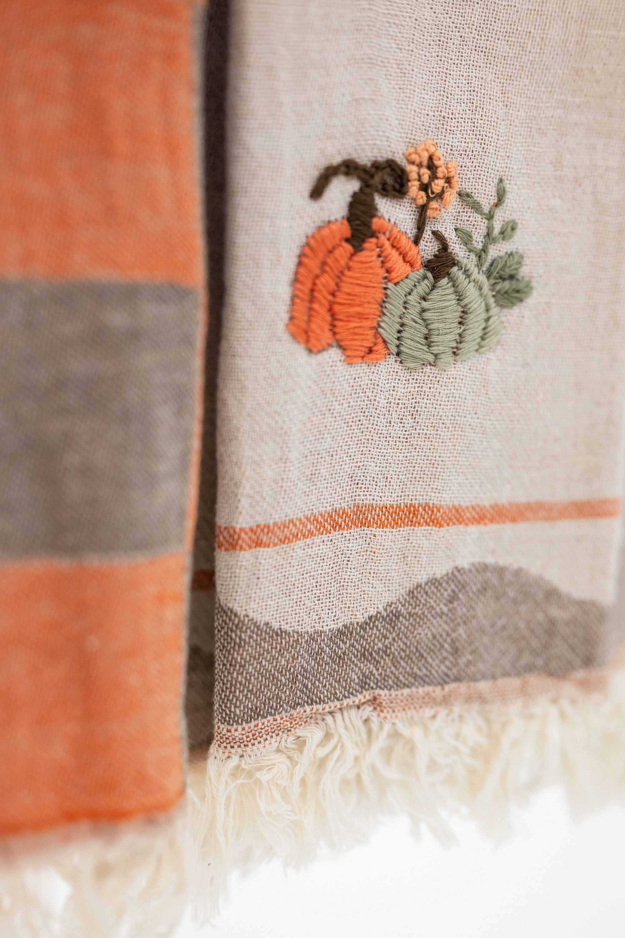 close up look at the embroidered pumpkins on turkish cotton kitchen towels