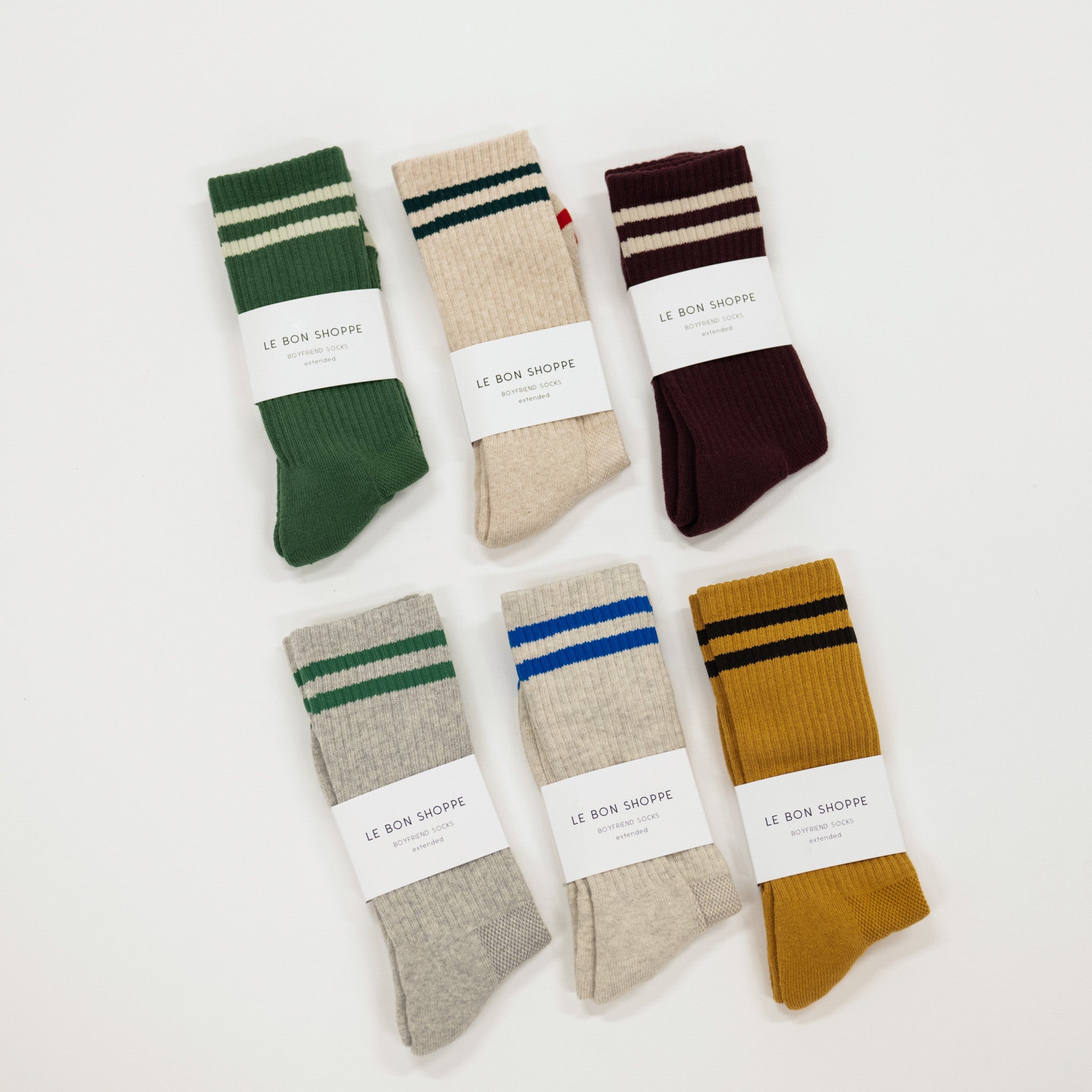 Set of six pairs of striped socks in various colors with 'Le Bon Shoppe' labels on a white background.