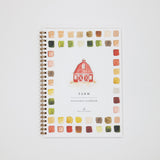 Watercolor workbook with a barn illustration on a white background