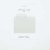 A package of cloth & paper Tab Sticky Notes in the shade Fawn, showing a single folded note with a tab on a white backing card against a light gray background.