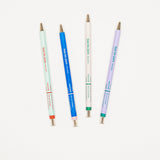 Four pens with different colored barrels on a white background