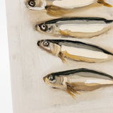 Four preserved fish on a white background with a black stand