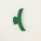 forest green matte colored mini sized kaxi hold everything hair claw