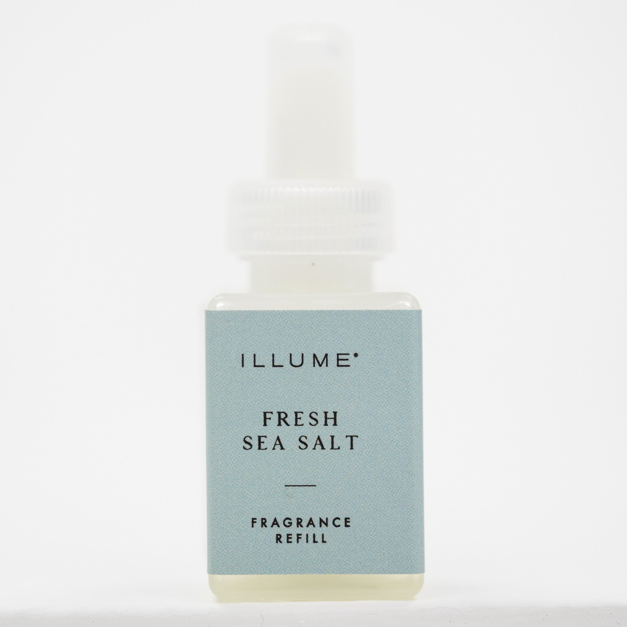 ILLUME Fresh Sea Salt pura fragrance refill in a small square bottle with a pale blue label and white dropper cap, centered on a white background.