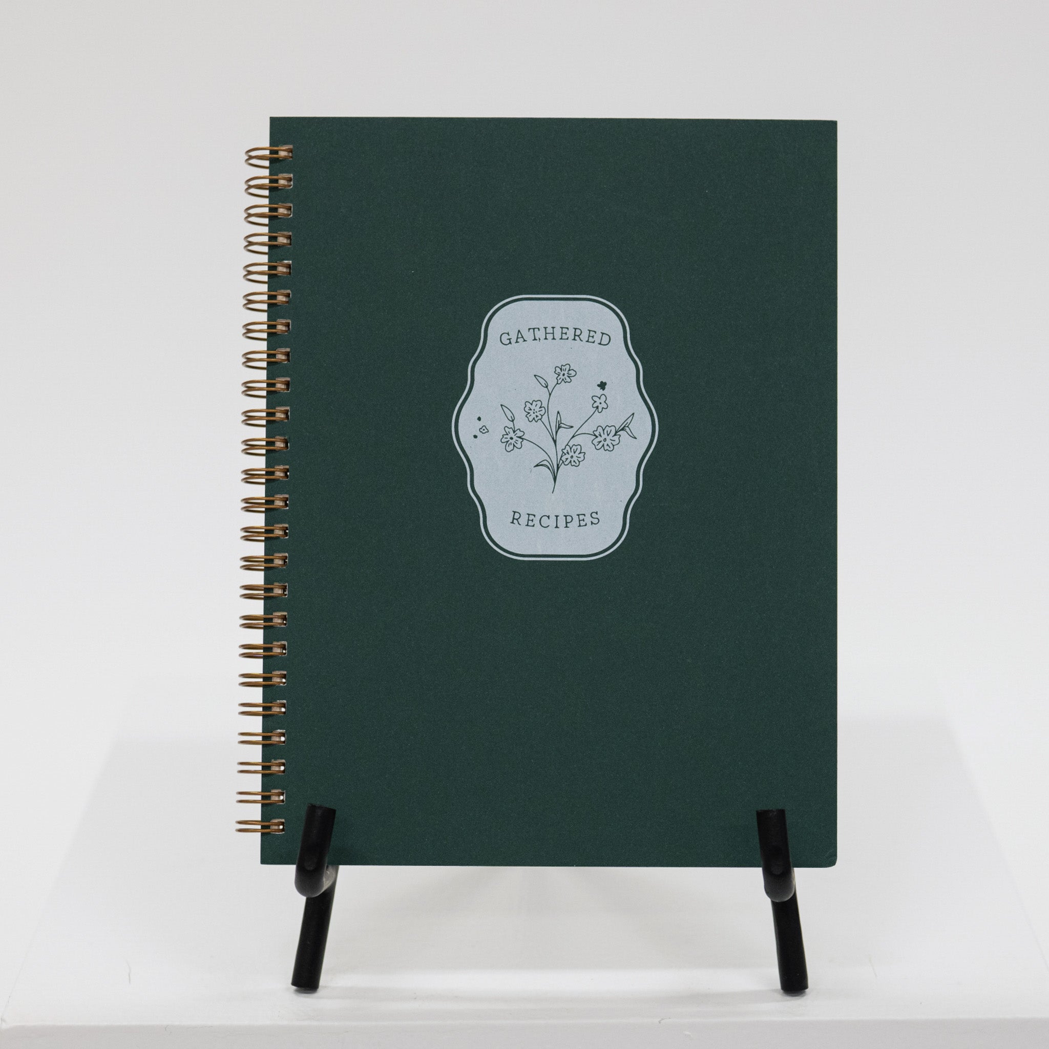 Green notebook with 'Gathered Recipes' design on a white background