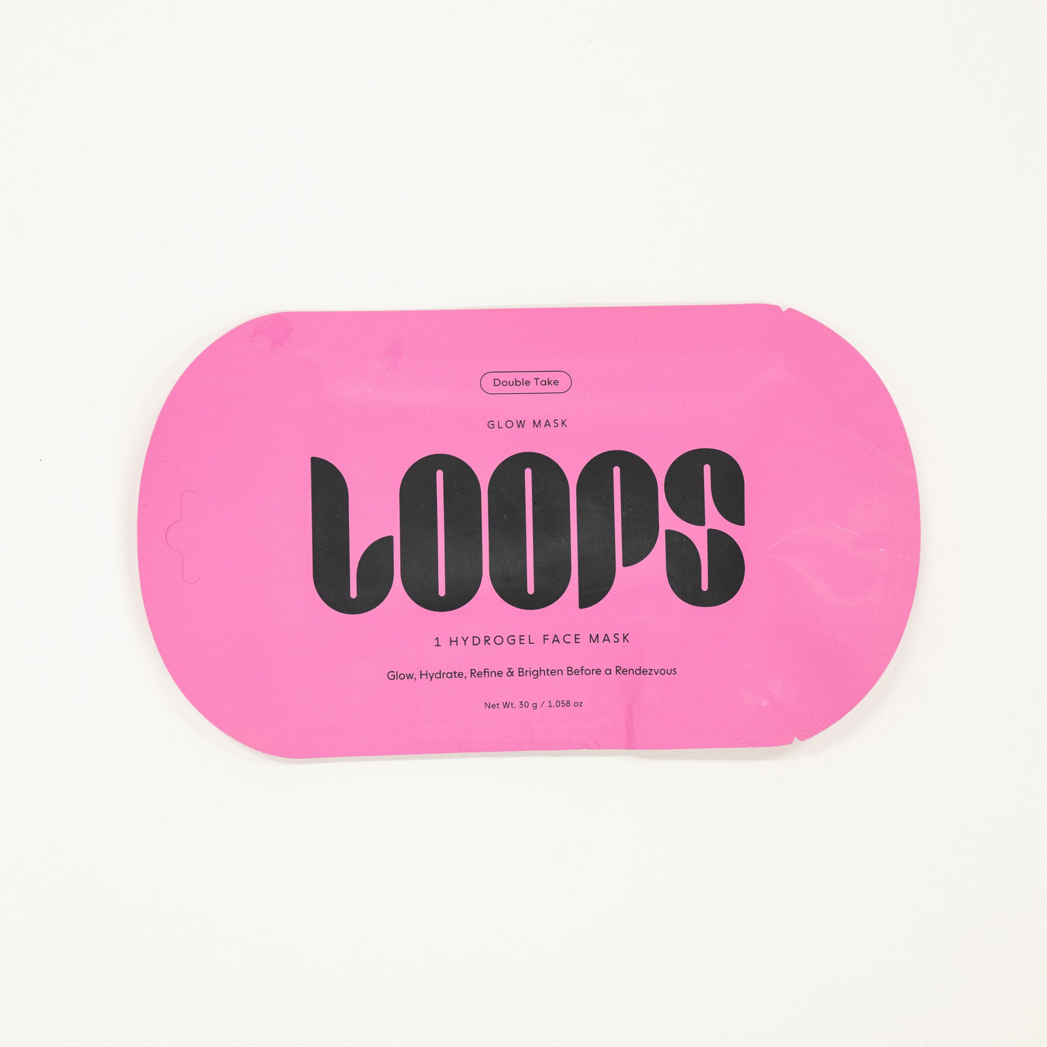 Pink packaging of LOOPS hydrogel face masks on a white background