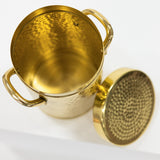 Gold metal canister with lid on a white background