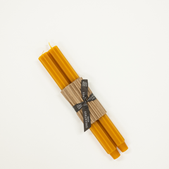 dark yellow candle taper with fluted sides