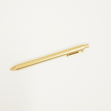 Gold pen on a white background