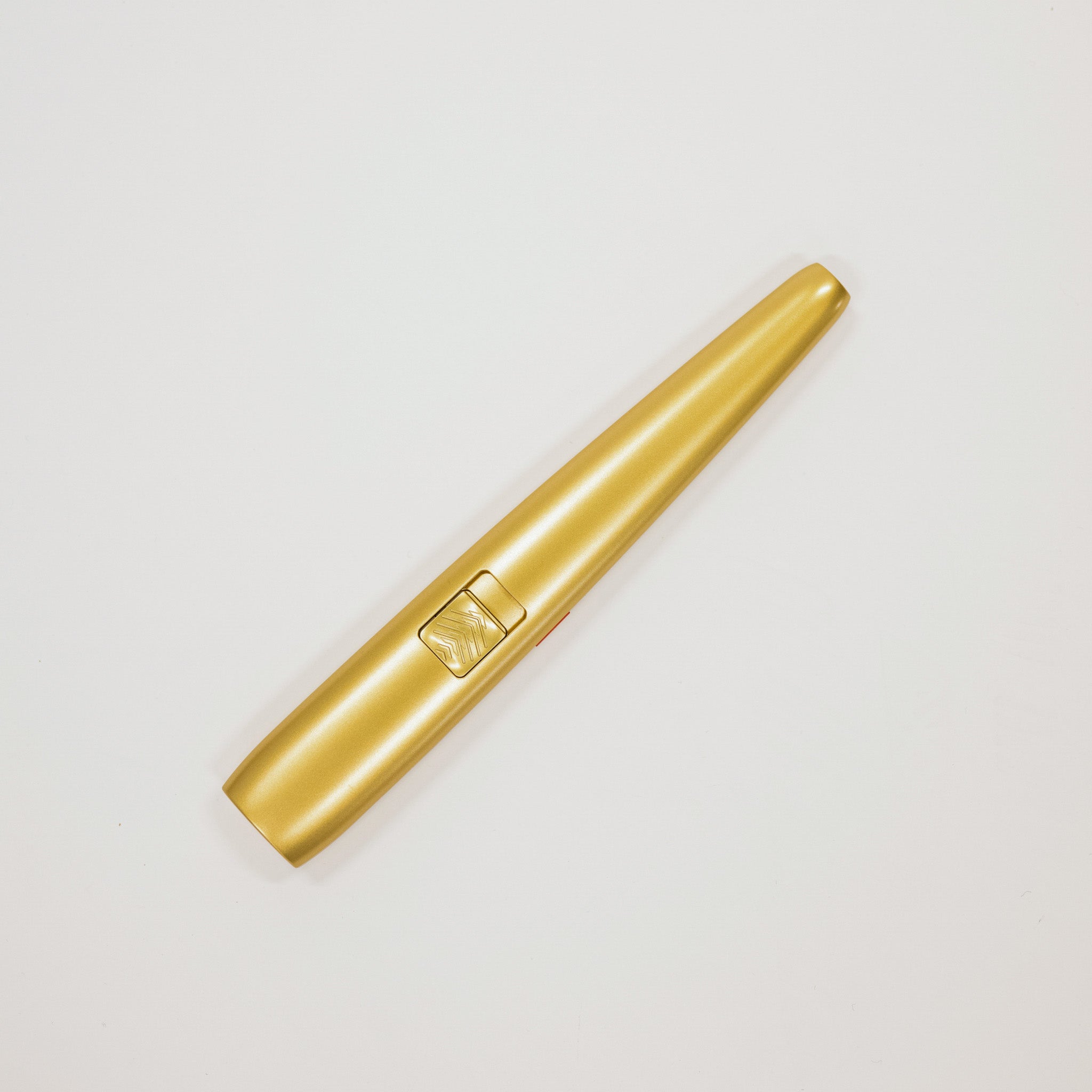 Gold lighter on a light gray background