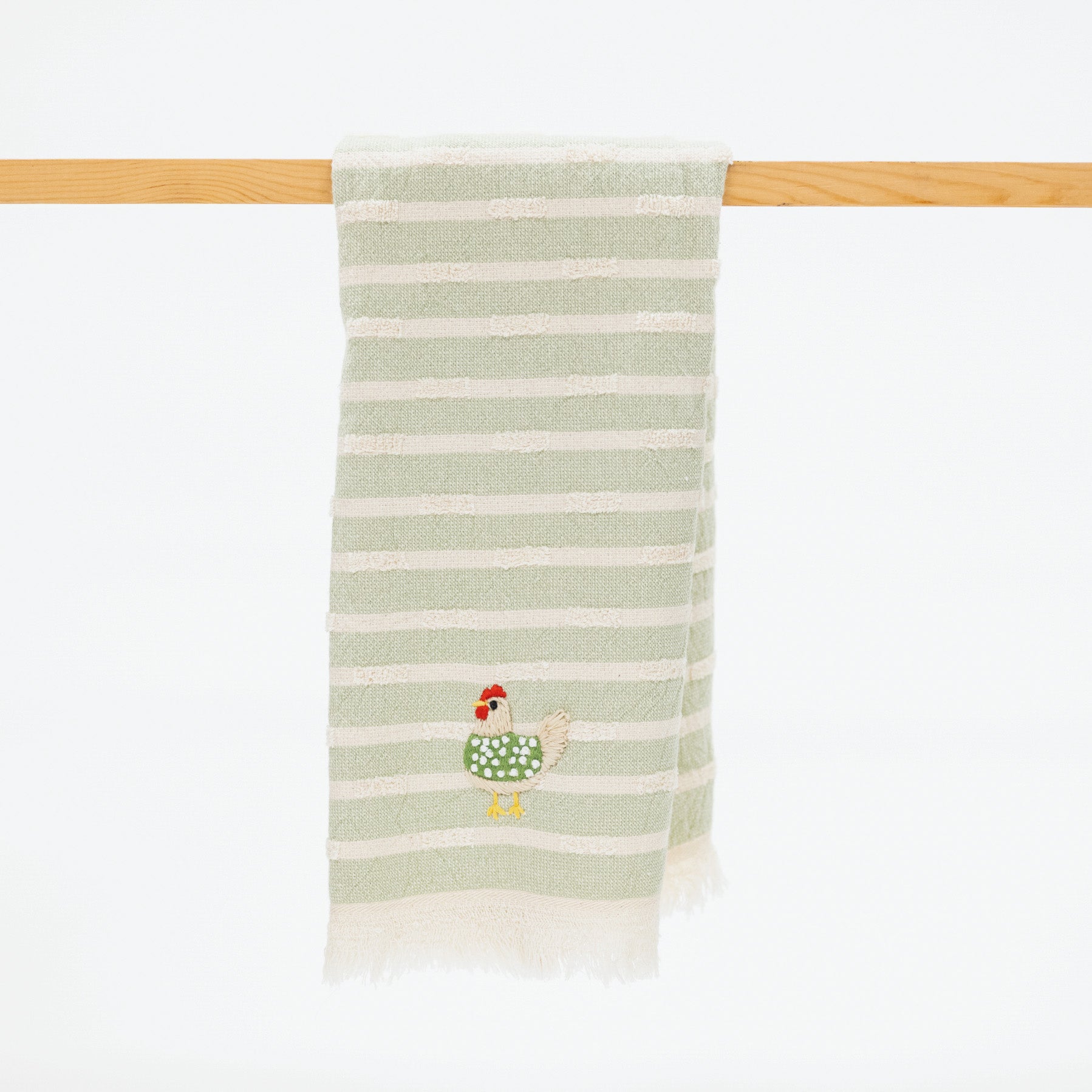 turkish cotton kitchen towel with light green and neutral stripes and a sweet embroidered chicken with a green sweater.