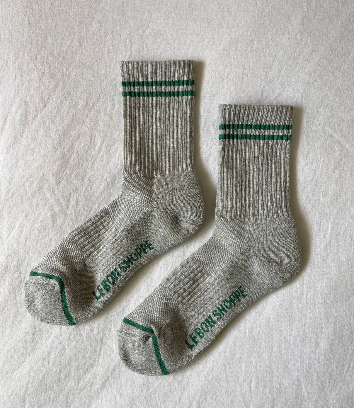 grey crew socks with green stripes and the brand name le bon shoppe. boyfriend style socks.