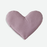 Heart-shaped eye pillow in a soft purple silk on a light gray background