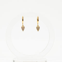 Gold heart-shaped earrings on a white background