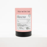  Tea With Tae 'Hibiscus Rose' tea sachets, featuring a pastel pink label with black text and a matte black base, set against a plain white background.