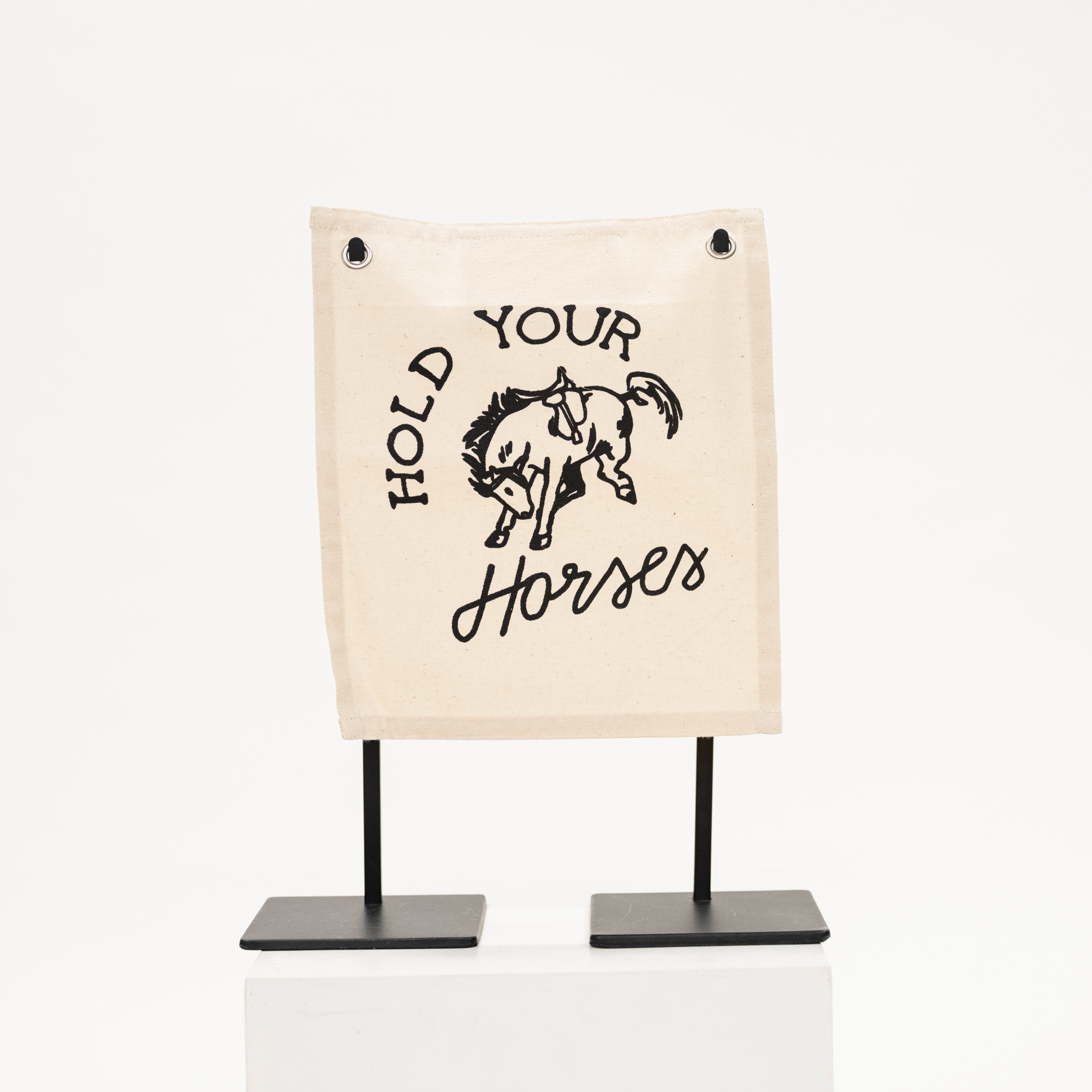 canvas wall sign with phrase hold your horses and hand drawn horse